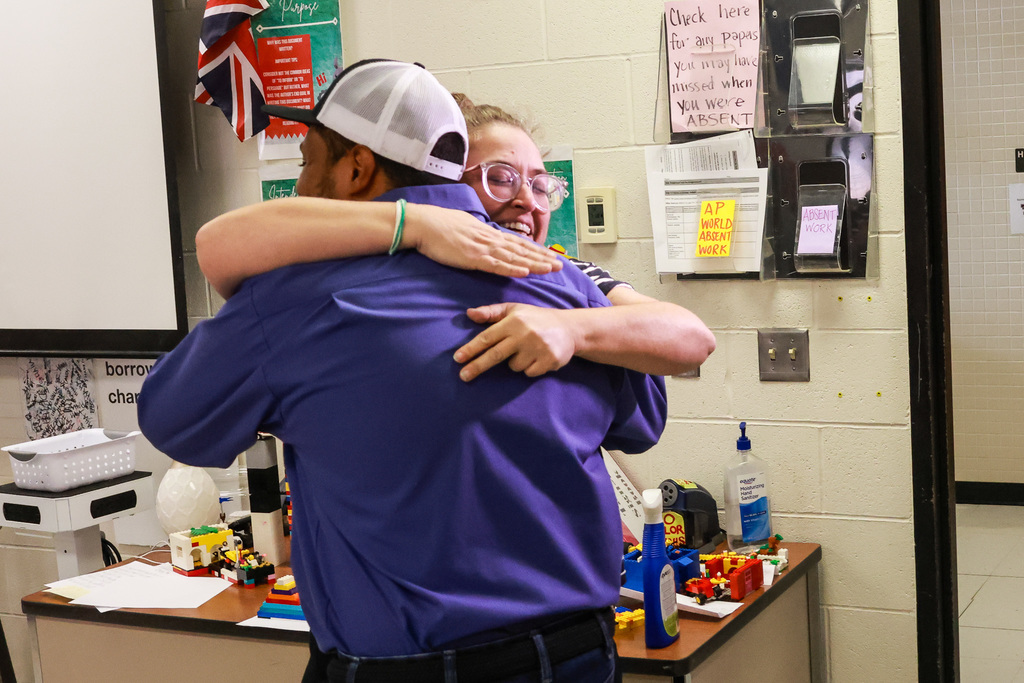 Ms. Brue hugs during the surprise