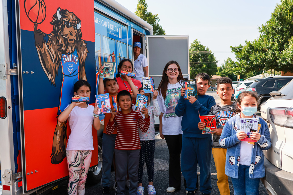 group photo outside book bus
