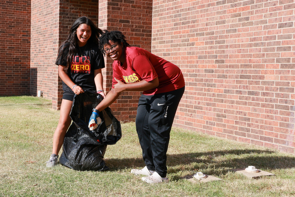 students picking up trash