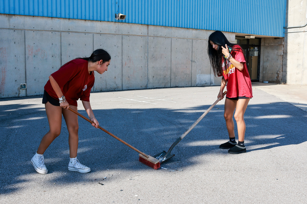students cleaning the playground